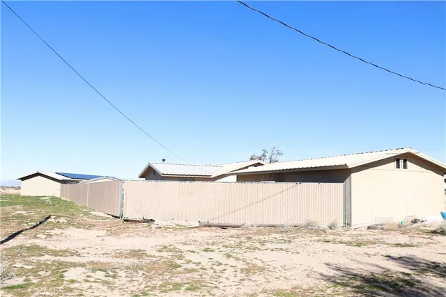 a view of a wooden fence and floor