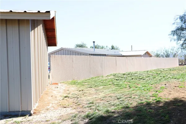 a view of a wooden fence and floor