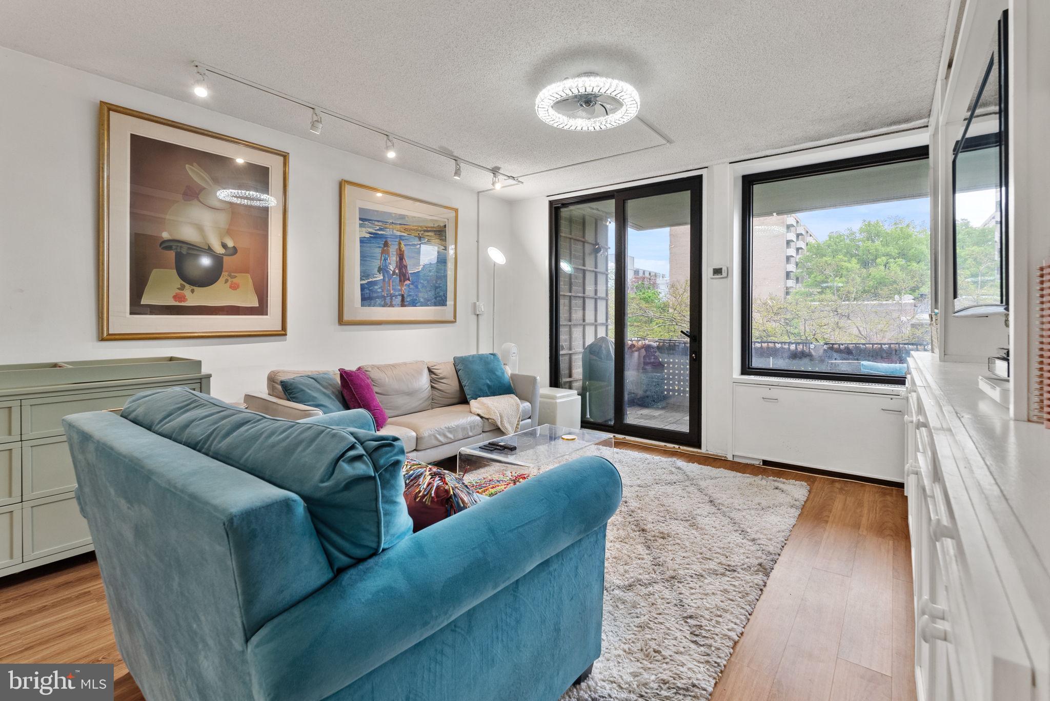 1250 4th Street Southwest, Unit W107 Washington, DC 20024 - Photo 12 of 30 a living room with furniture and large window