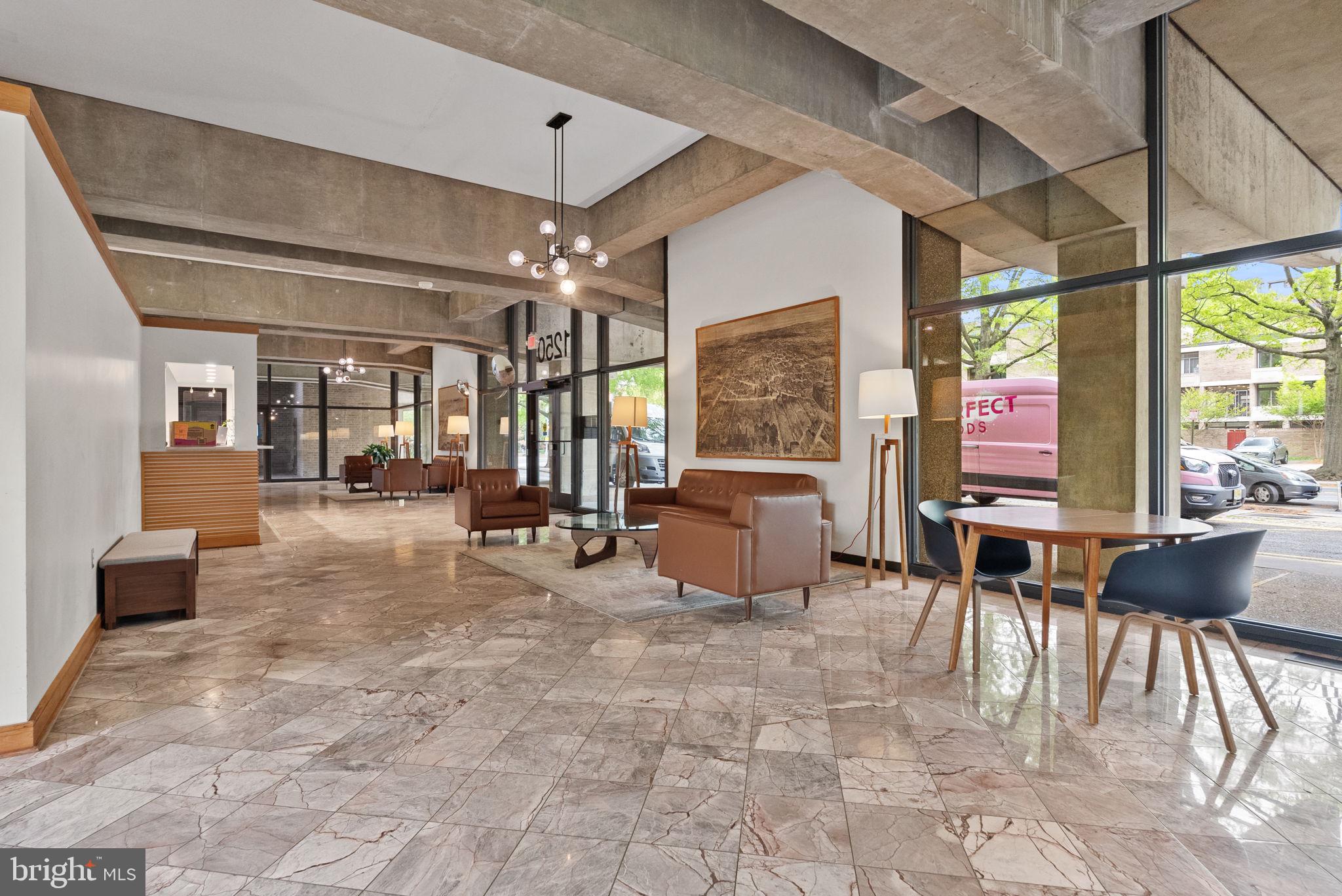 1250 4th Street Southwest, Unit W107 Washington, DC 20024 - Photo 28 of 30 a living room with furniture and a large window