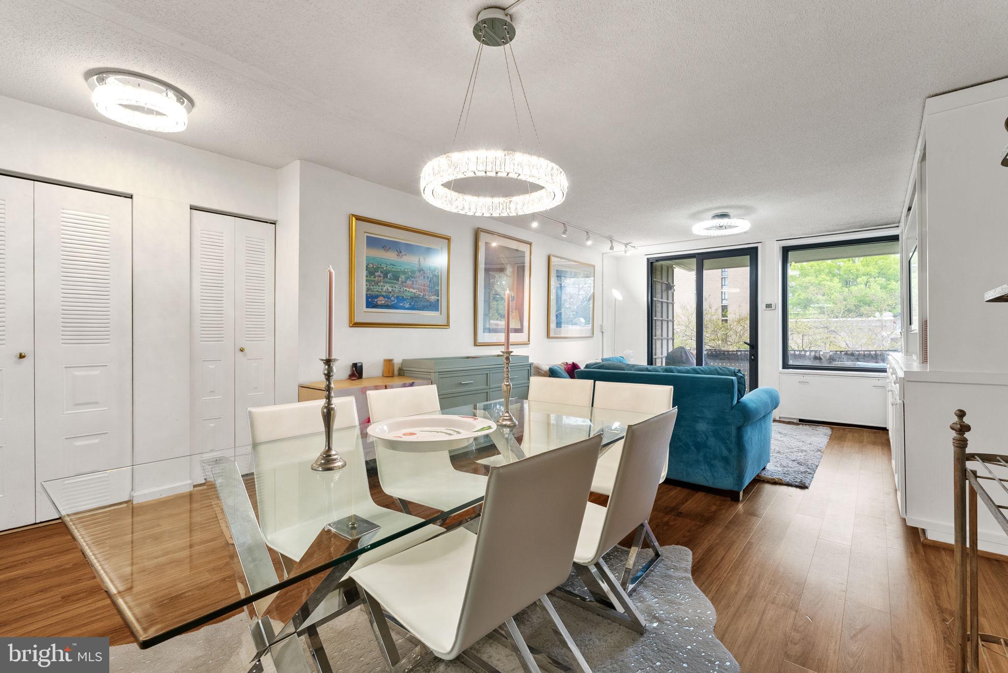 1250 4th Street Southwest, Unit W107 Washington, DC 20024 - Photo 6 of 30 a view of a dining room with furniture window and wooden floor