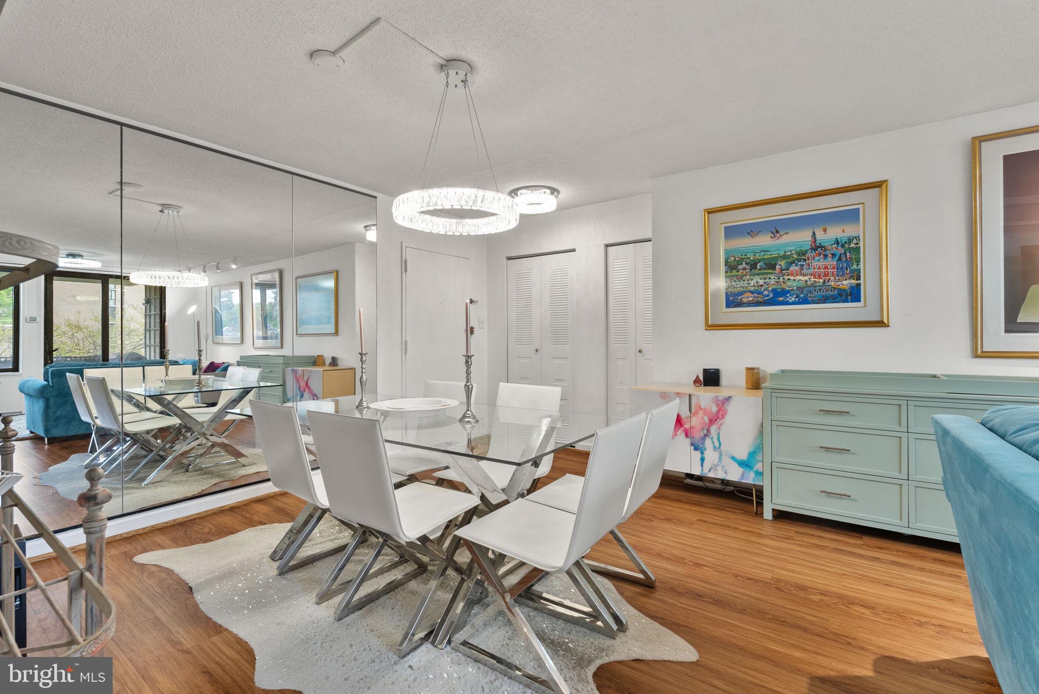 1250 4th Street Southwest, Unit W107 Washington, DC 20024 - Photo 7 of 30 a view of a dining room with furniture and a chandelier