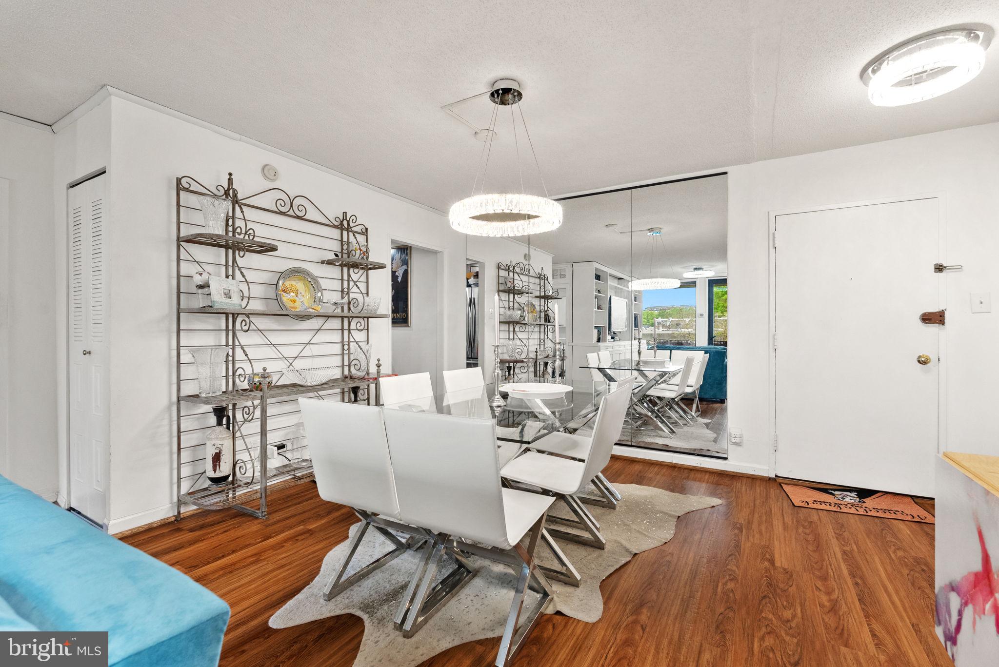 1250 4th Street Southwest, Unit W107 Washington, DC 20024 - Photo 8 of 30 a living room with furniture and wooden floor