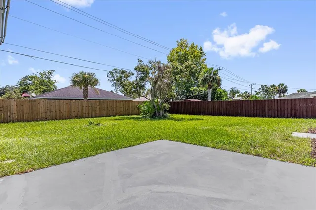 an aerial view of a house with a garden