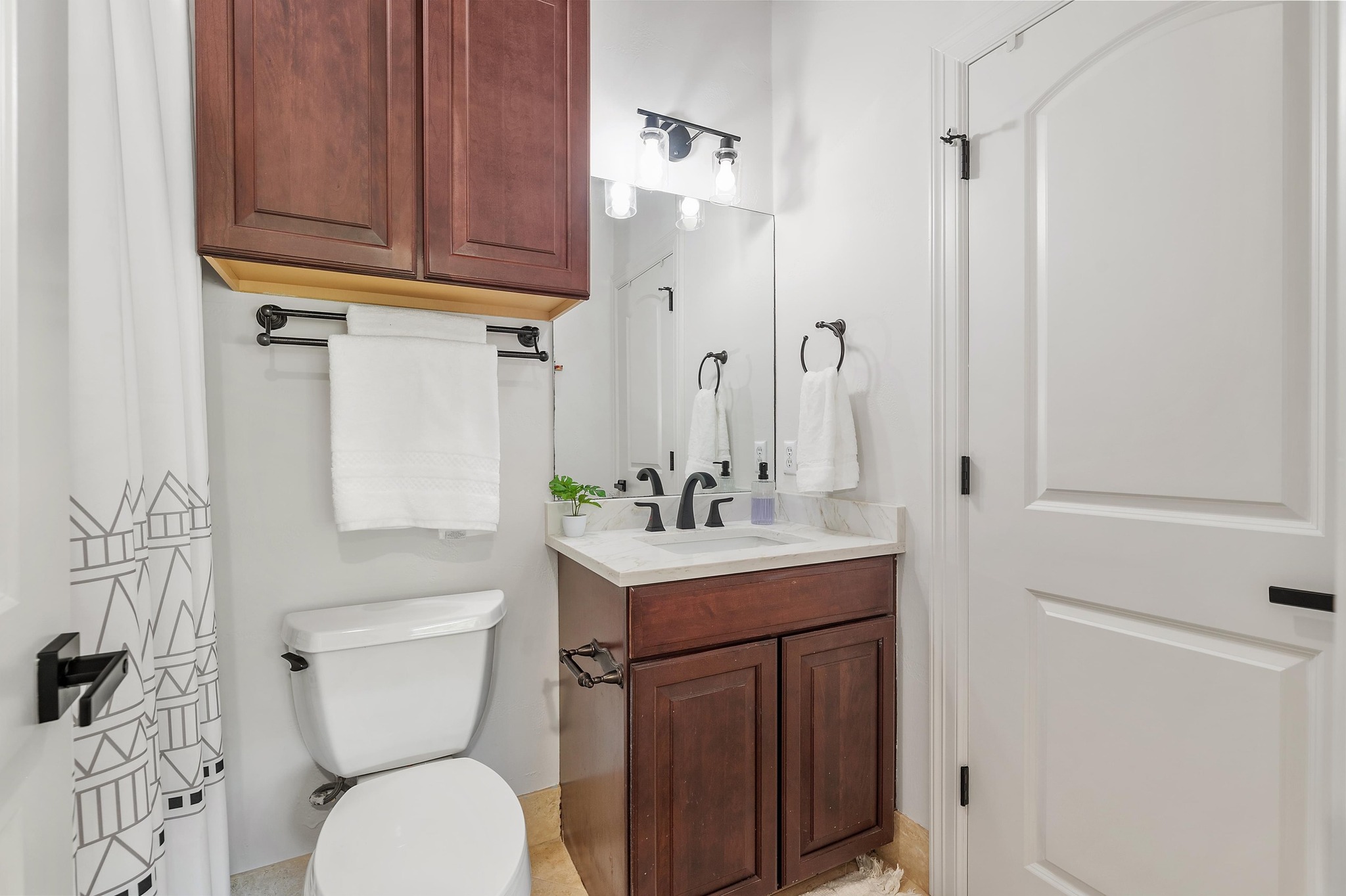 7 Sunview Road The Hills, TX 78738 - Photo 27 of 40 a bathroom with a sink a toilet and shower