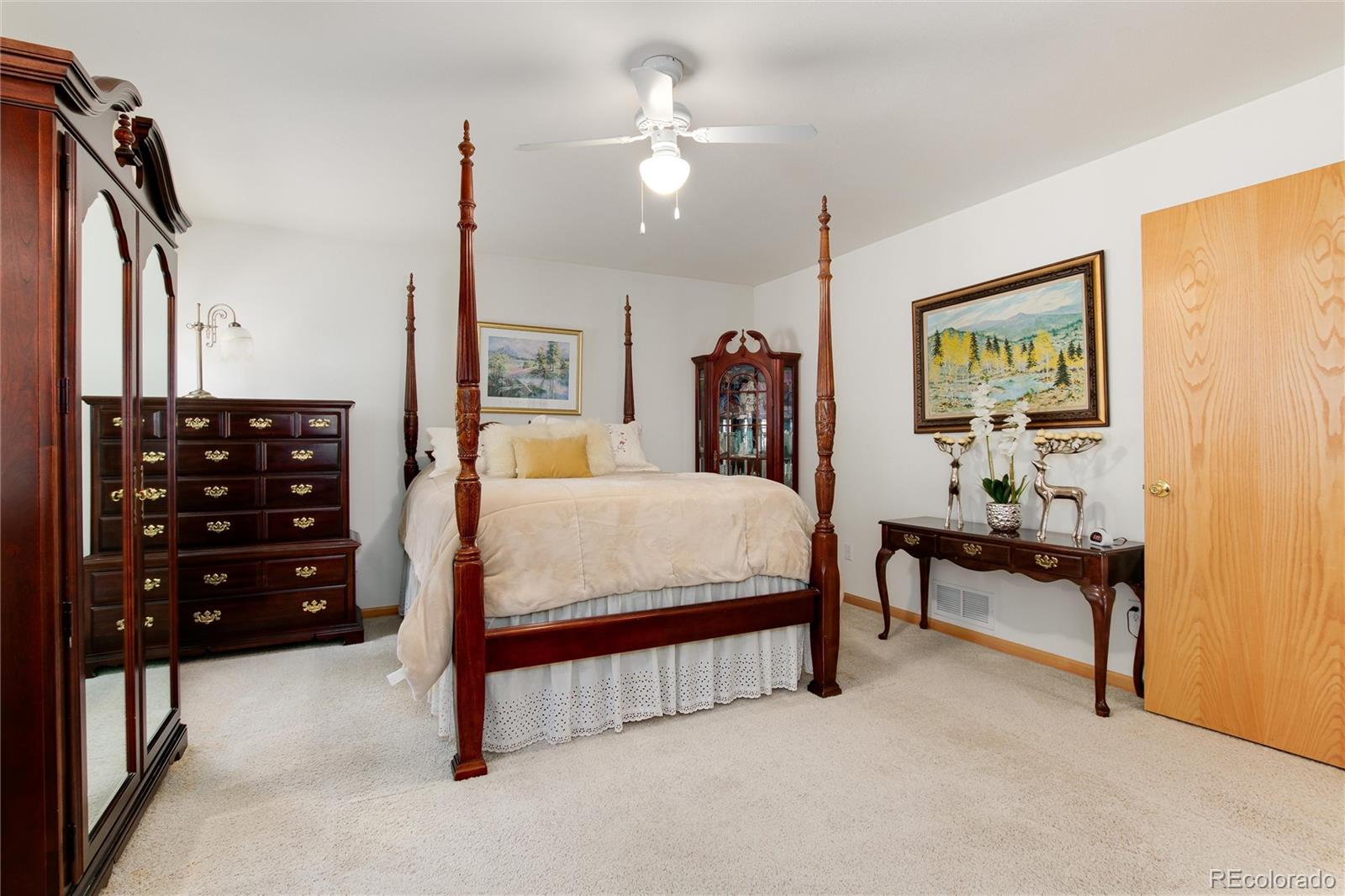1211 Hughesville Road Black Hawk, CO 80422 - Photo 19 of 39 a bedroom with a bed and a chandelier