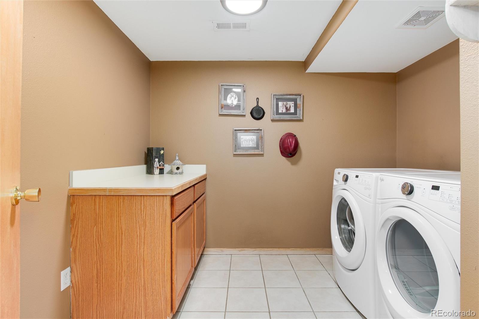 1211 Hughesville Road Black Hawk, CO 80422 - Photo 25 of 39 a utility room with dryer and washer