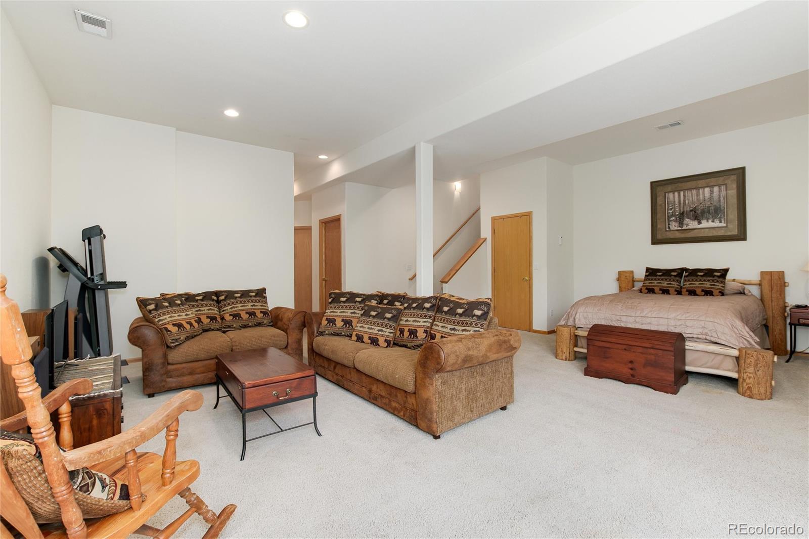 1211 Hughesville Road Black Hawk, CO 80422 - Photo 26 of 39 a bedroom with furniture and a couch