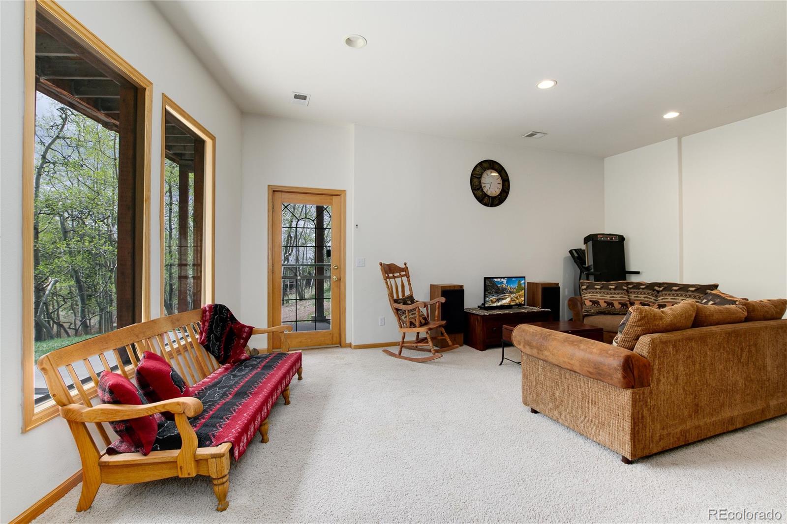 1211 Hughesville Road Black Hawk, CO 80422 - Photo 29 of 39 a living room with furniture and a large window