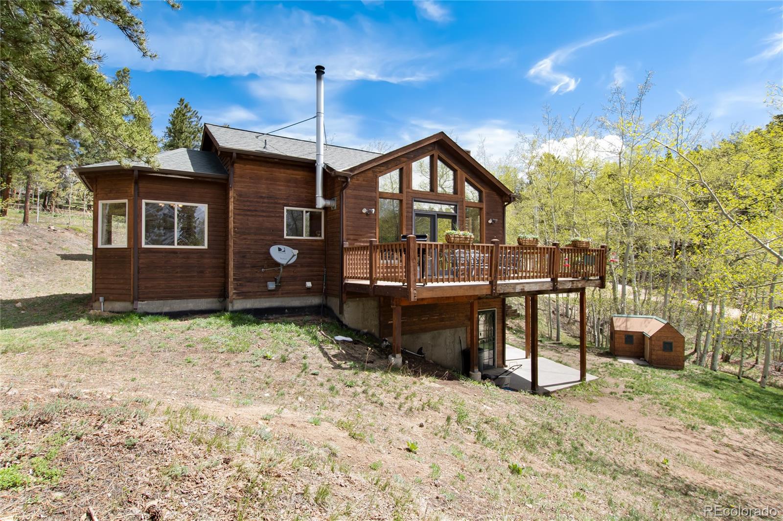 1211 Hughesville Road Black Hawk, CO 80422 - Photo 33 of 39 a front view of a house with a yard