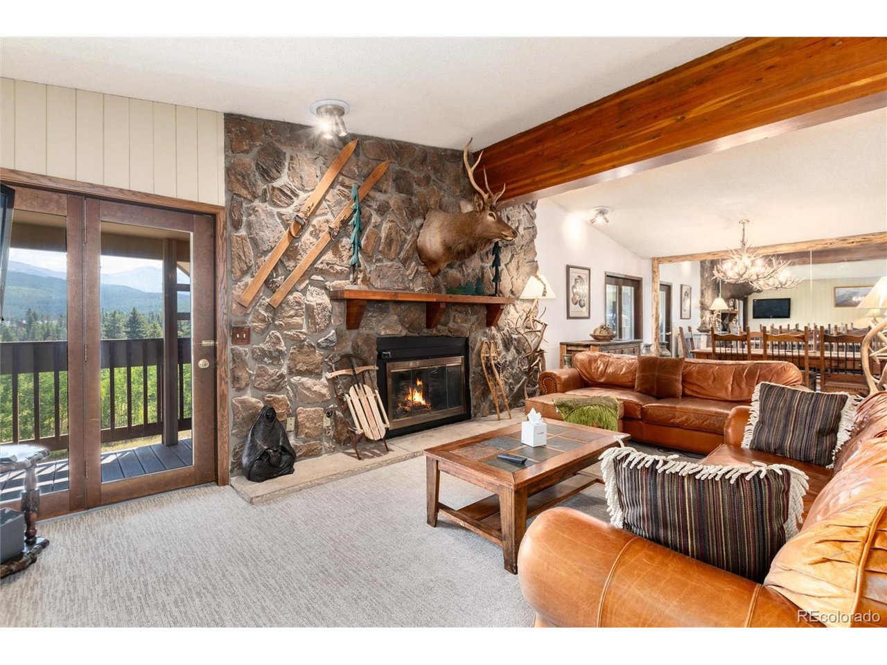490 Kings Crossing Road, Unit 631 Winter Park, CO 80482 - Photo 7 of 43 a living room with furniture and a fireplace