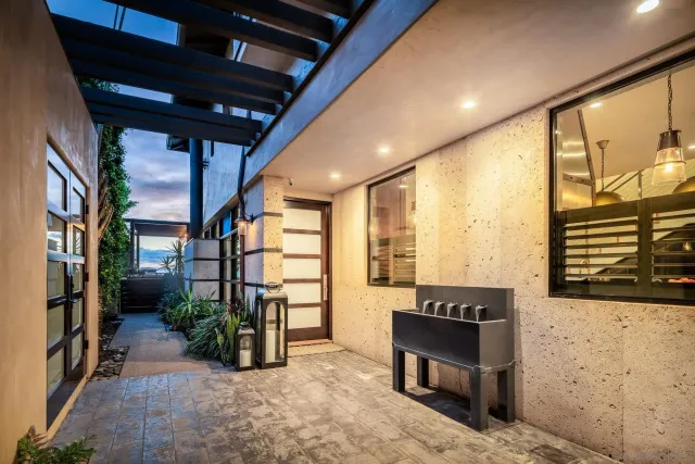 a view of an entryway with wooden floor and a bench