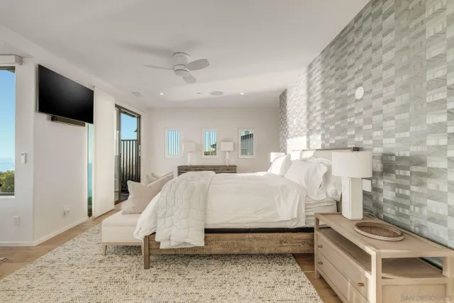 a bed room with a bed and a television