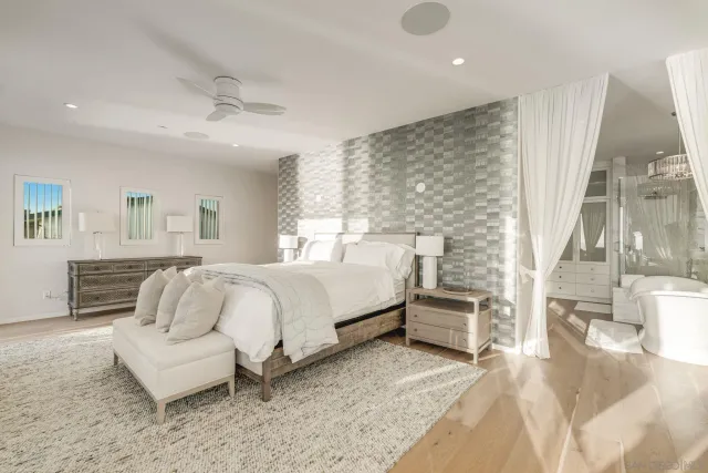 a bedroom with a large bed and a couch