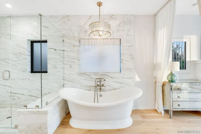 a spacious bathroom with a double vanity sink mirror and