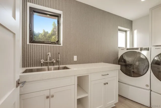 a kitchen with a table chairs and a stove