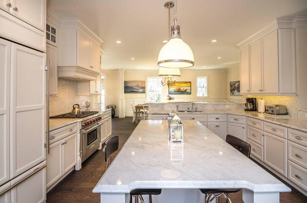 6 Nora's Lane Edgartown, MA 02539 - Photo 13 of 30 a large kitchen with stainless steel appliances granite countertop a sink a stove and a refrigerator