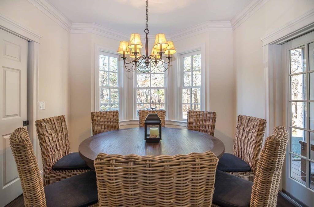 6 Nora's Lane Edgartown, MA 02539 - Photo 14 of 30 a view of a dining room with furniture wooden floor and chandelier