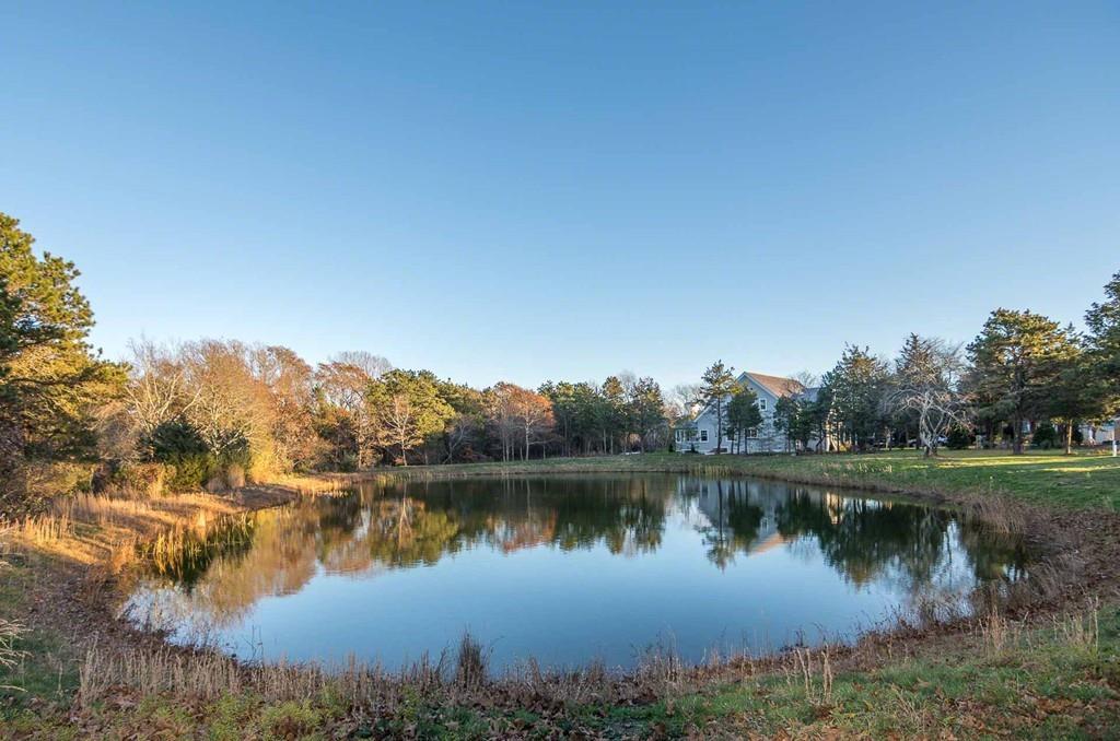 6 Nora's Lane Edgartown, MA 02539 - Photo 30 of 30 a view of a lake with houses in the back