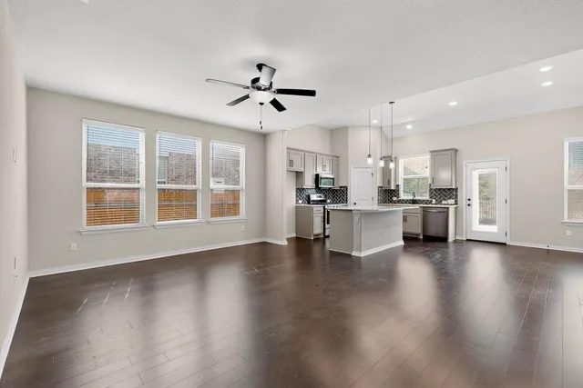 a view of kitchen with sink and wooden floor