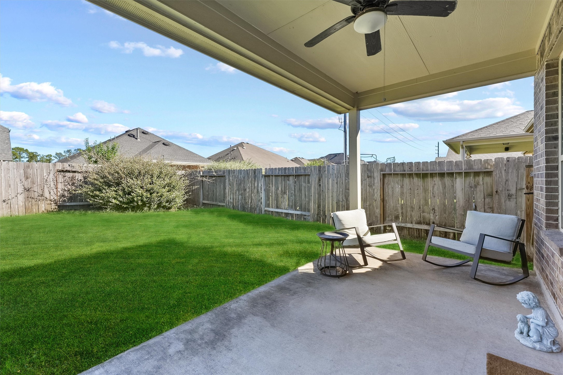 3841 Enchanted Timbers Lane Spring, TX 77386 - Photo 18 of 28 a view of a patio with table and chairs with wooden fence