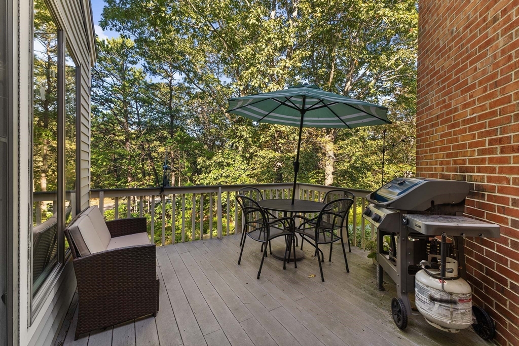 26 Quarry Ridge Lane, Unit 26 Rockport, MA 01966 - Photo 12 of 37 a view of balcony with furniture and barbeque oven