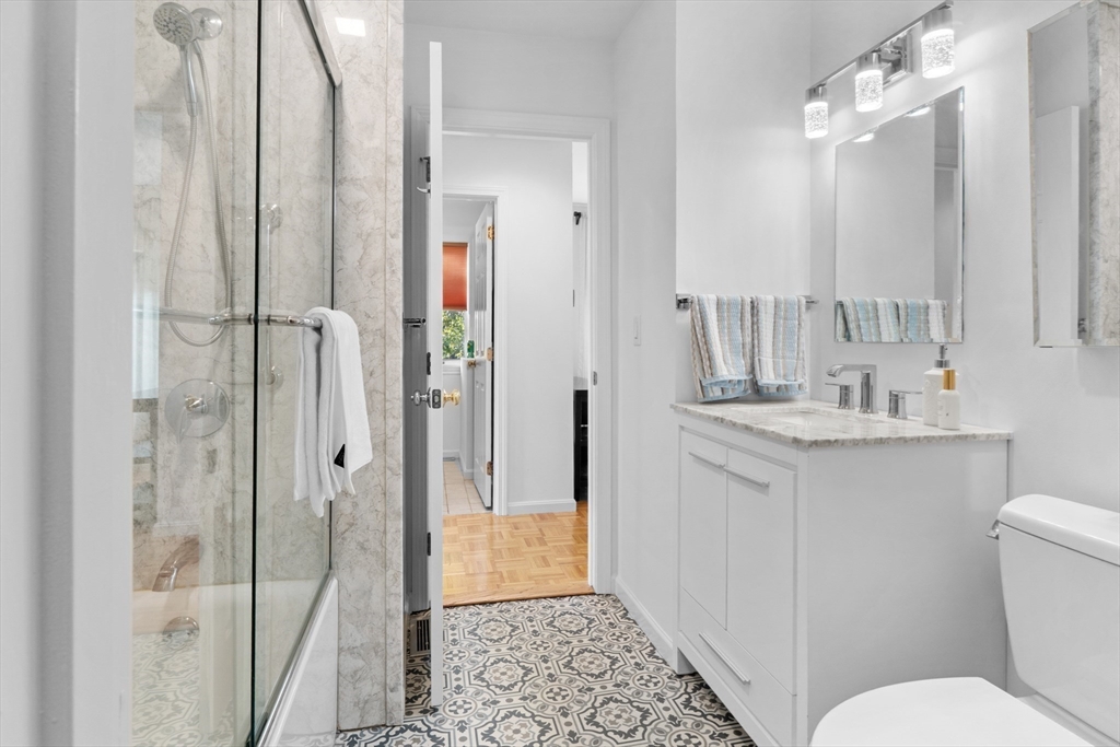 26 Quarry Ridge Lane, Unit 26 Rockport, MA 01966 - Photo 15 of 37 a bathroom with a sink a toilet and shower