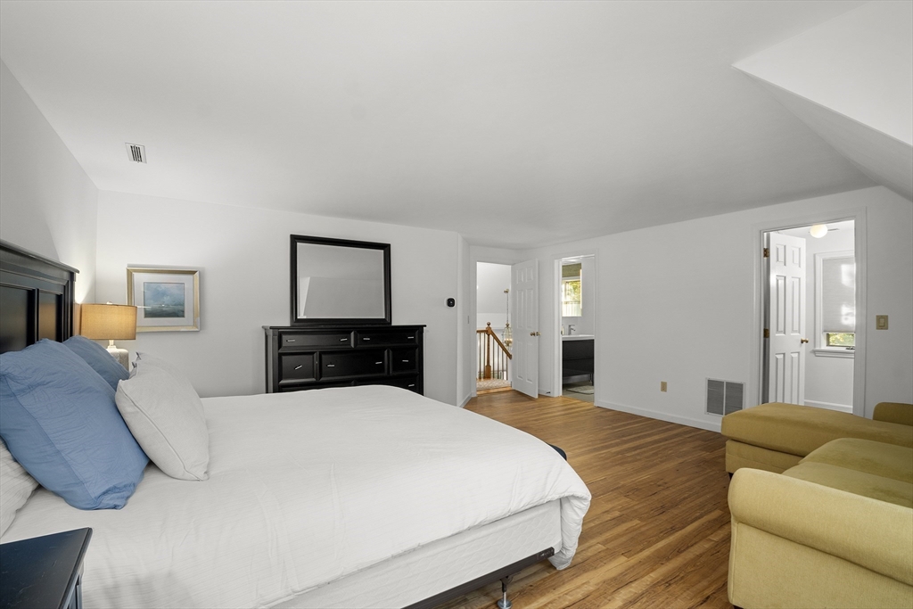 26 Quarry Ridge Lane, Unit 26 Rockport, MA 01966 - Photo 19 of 37 a bedroom with a large bed and a tv