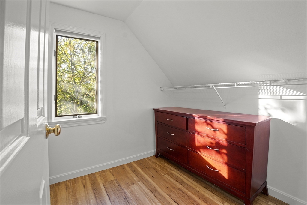 26 Quarry Ridge Lane, Unit 26 Rockport, MA 01966 - Photo 20 of 37 a view of room with window and wooden floor