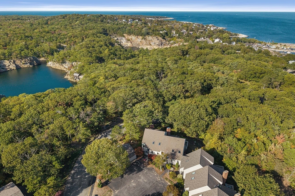 26 Quarry Ridge Lane, Unit 26 Rockport, MA 01966 - Photo 2 of 37 an aerial view of residential houses with outdoor space