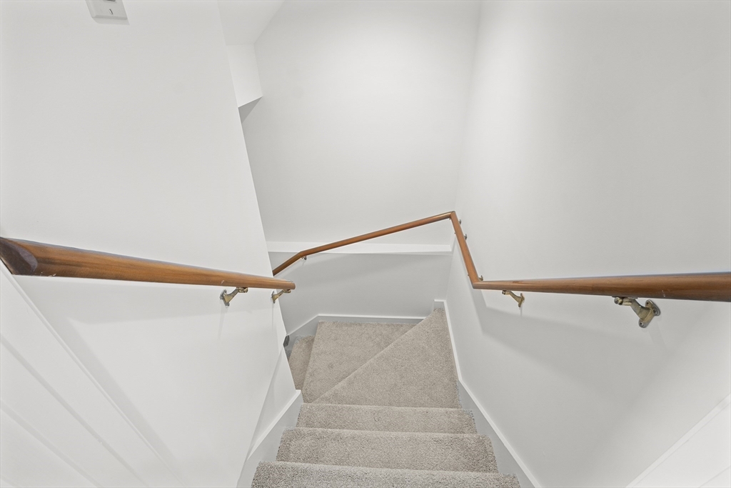 26 Quarry Ridge Lane, Unit 26 Rockport, MA 01966 - Photo 24 of 37 a view of closet with wooden floor