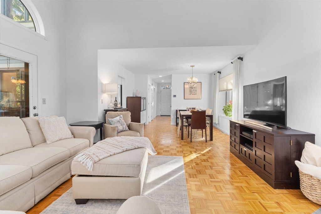 26 Quarry Ridge Lane, Unit 26 Rockport, MA 01966 - Photo 8 of 37 a living room with furniture and a flat screen tv