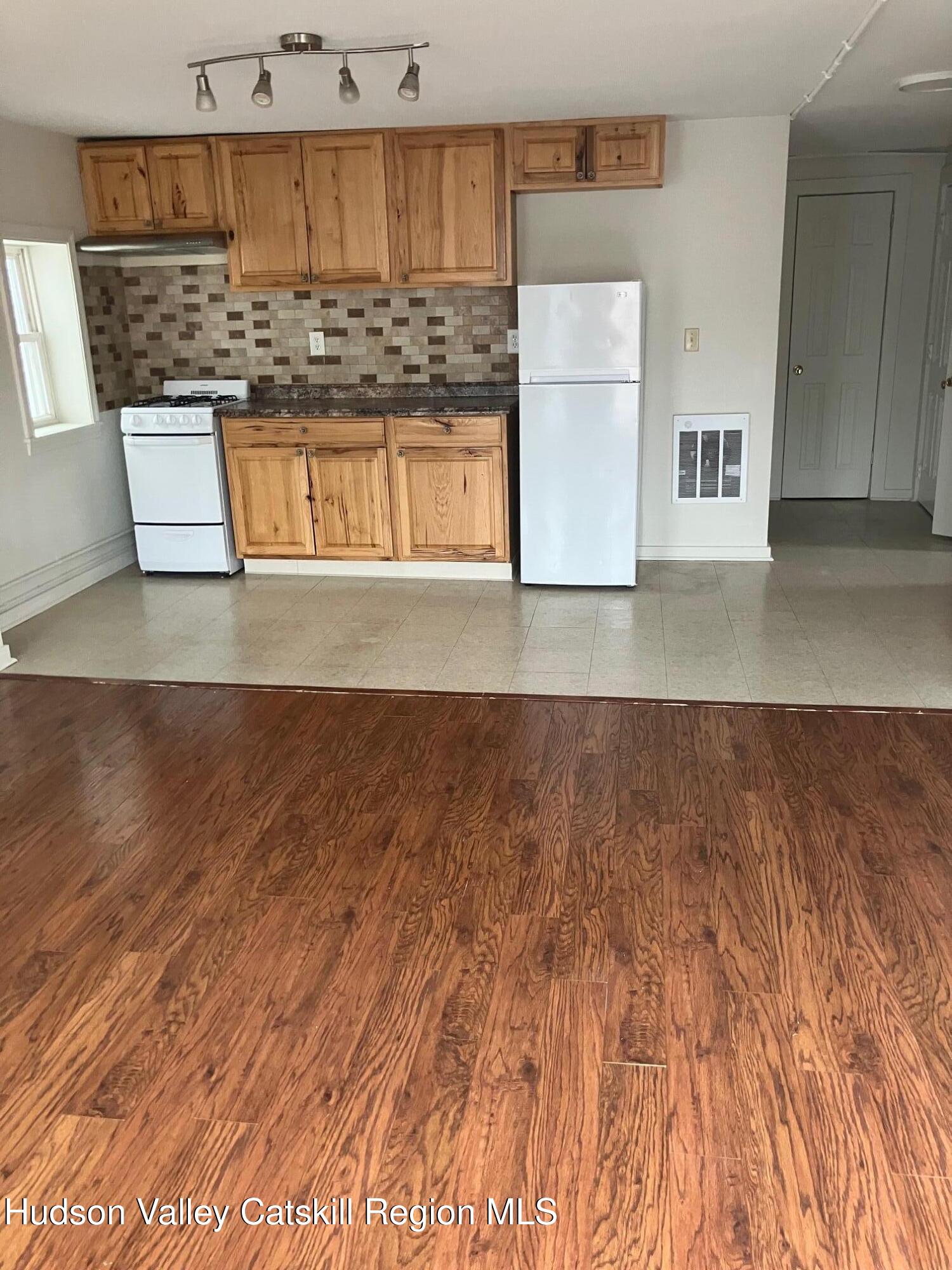434 Warren Street Hudson, NY 12534 - Photo 5 of 10 a view of kitchen cabinet and window