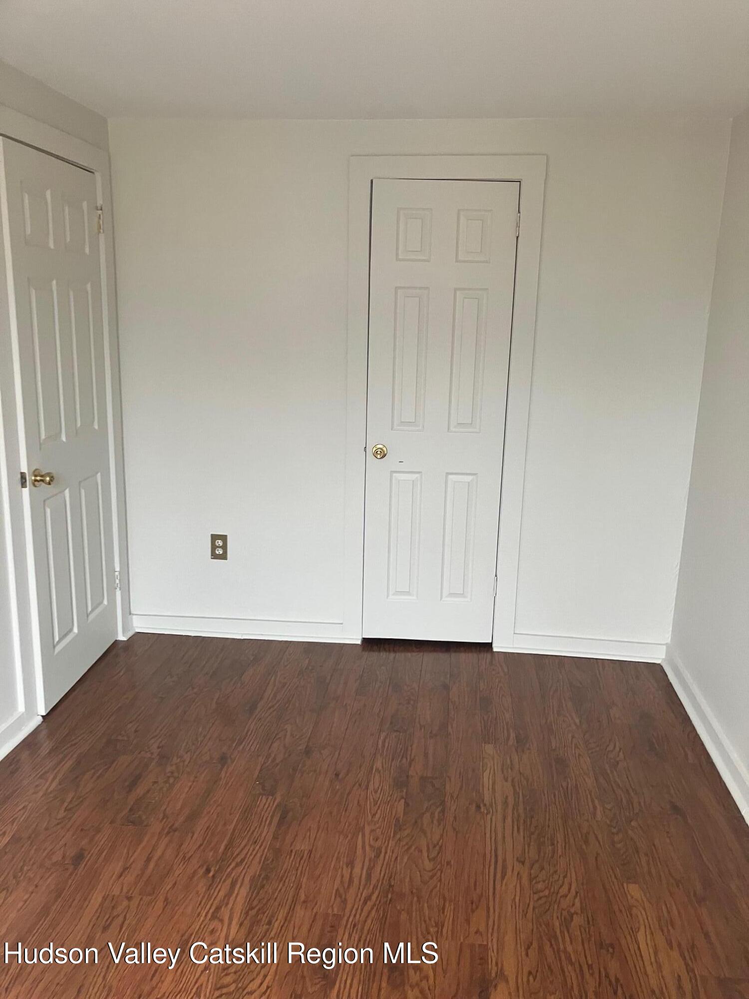 434 Warren Street Hudson, NY 12534 - Photo 7 of 10 a view of an empty room with wooden floor