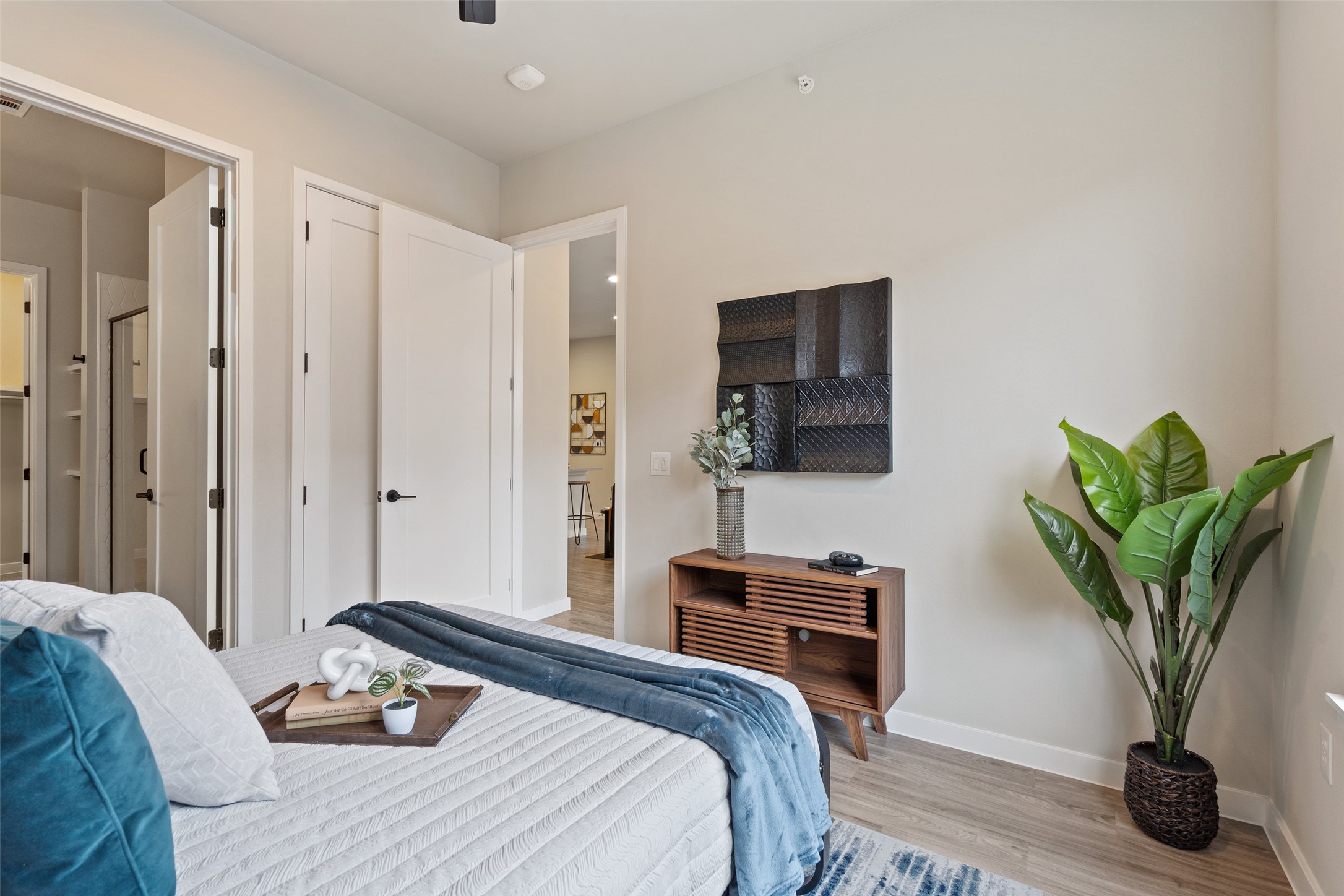 4510 Terry-O Lane, Unit 341 Austin, TX 78745 - Photo 26 of 40 This bedroom features light-colored walls and wood-look flooring