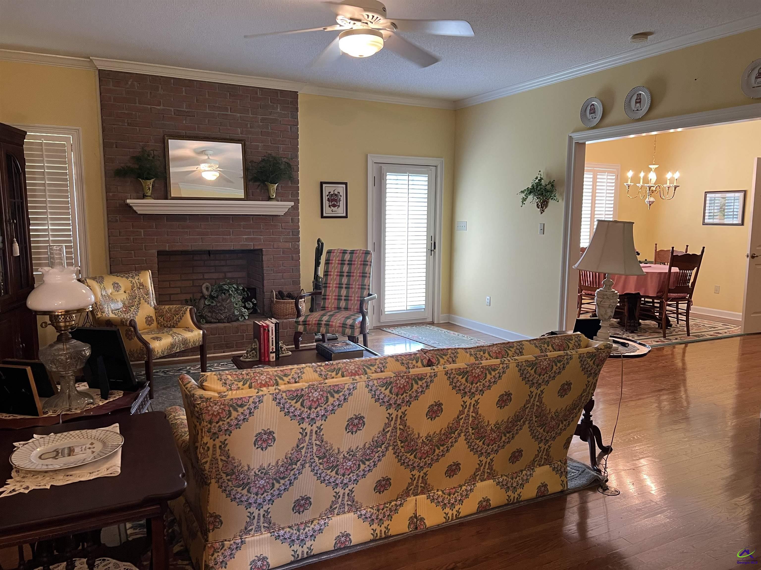 762 Nicholson-Carr Road Chester, GA 31012 - Photo 6 of 81 a living room with furniture and a fireplace