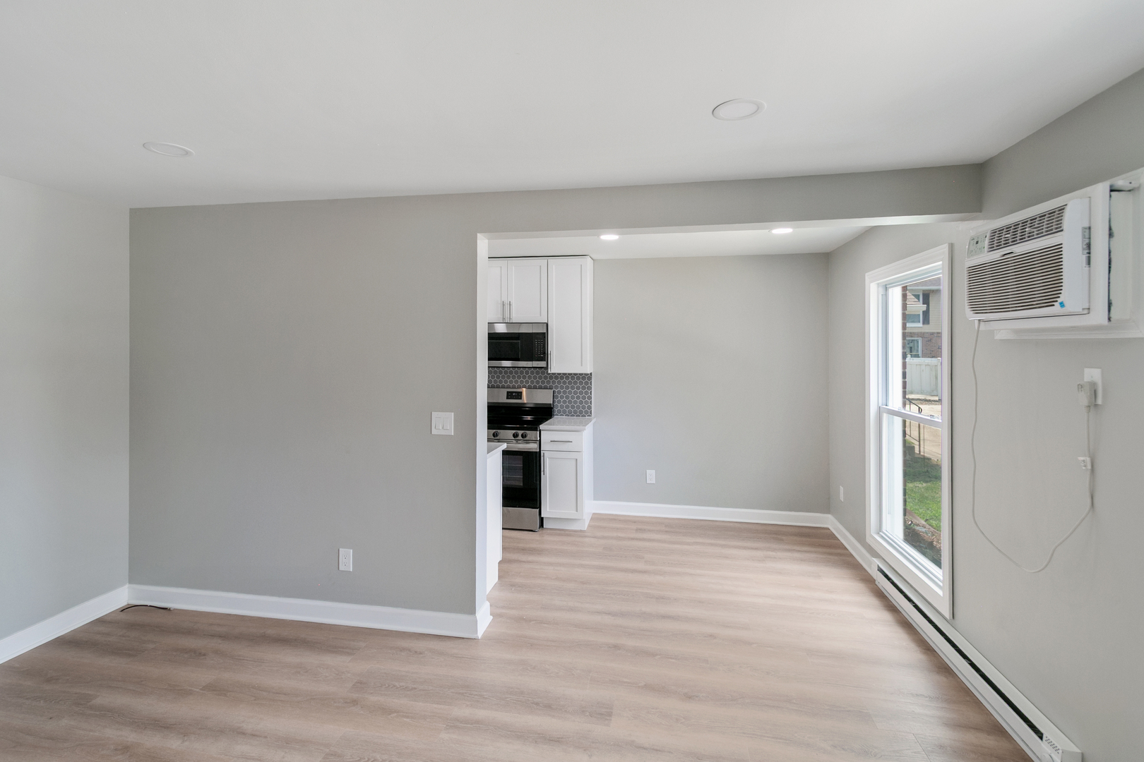 405 East Reed Street, Unit 9 Braidwood, IL 60408 - Photo 6 of 14 a view of kitchen with wooden floor