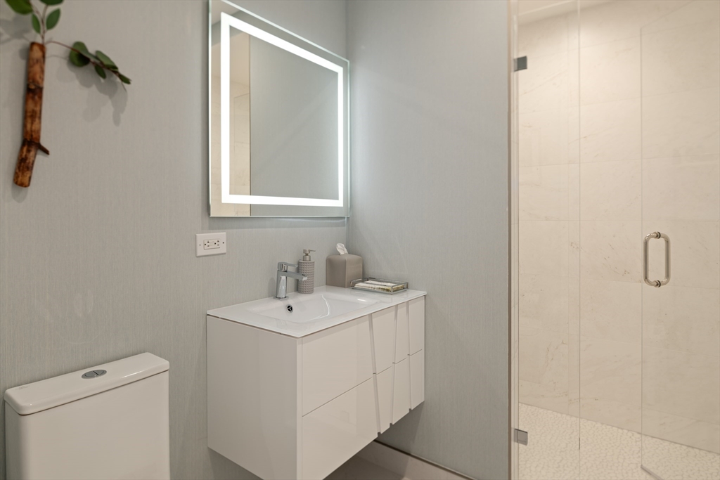 400 Stuart Street, Unit 17B Boston, MA 02116 - Photo 11 of 12 a utility room with dryer and washer