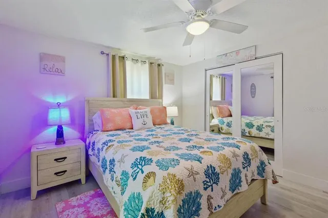 a bedroom with a bed dresser and a window