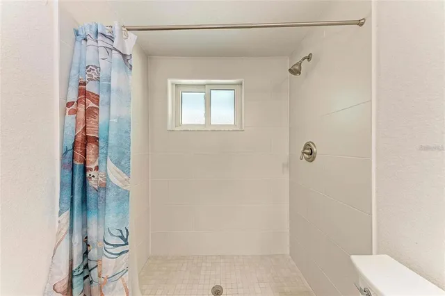 a large white bed in a white room