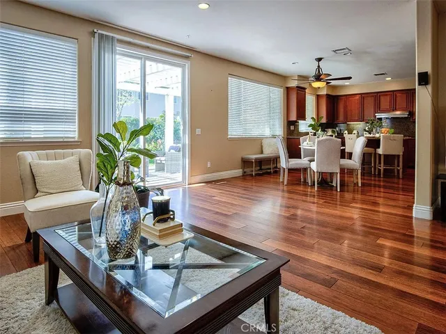 a living room with dining room and kitchen view