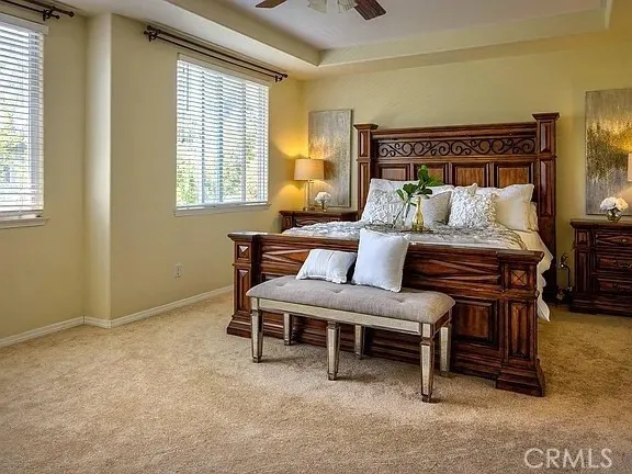 a bedroom with furniture and a window