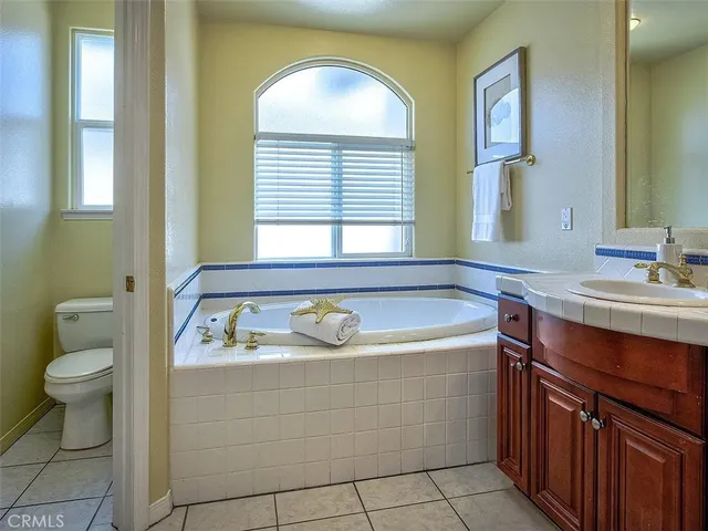 a bathroom with a sink a toilet and a bathtub