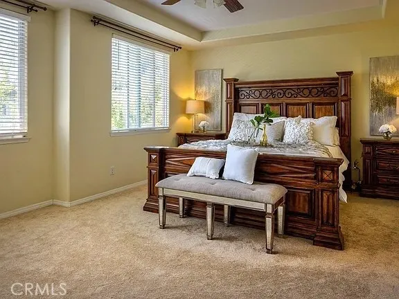 a bedroom with furniture and a window