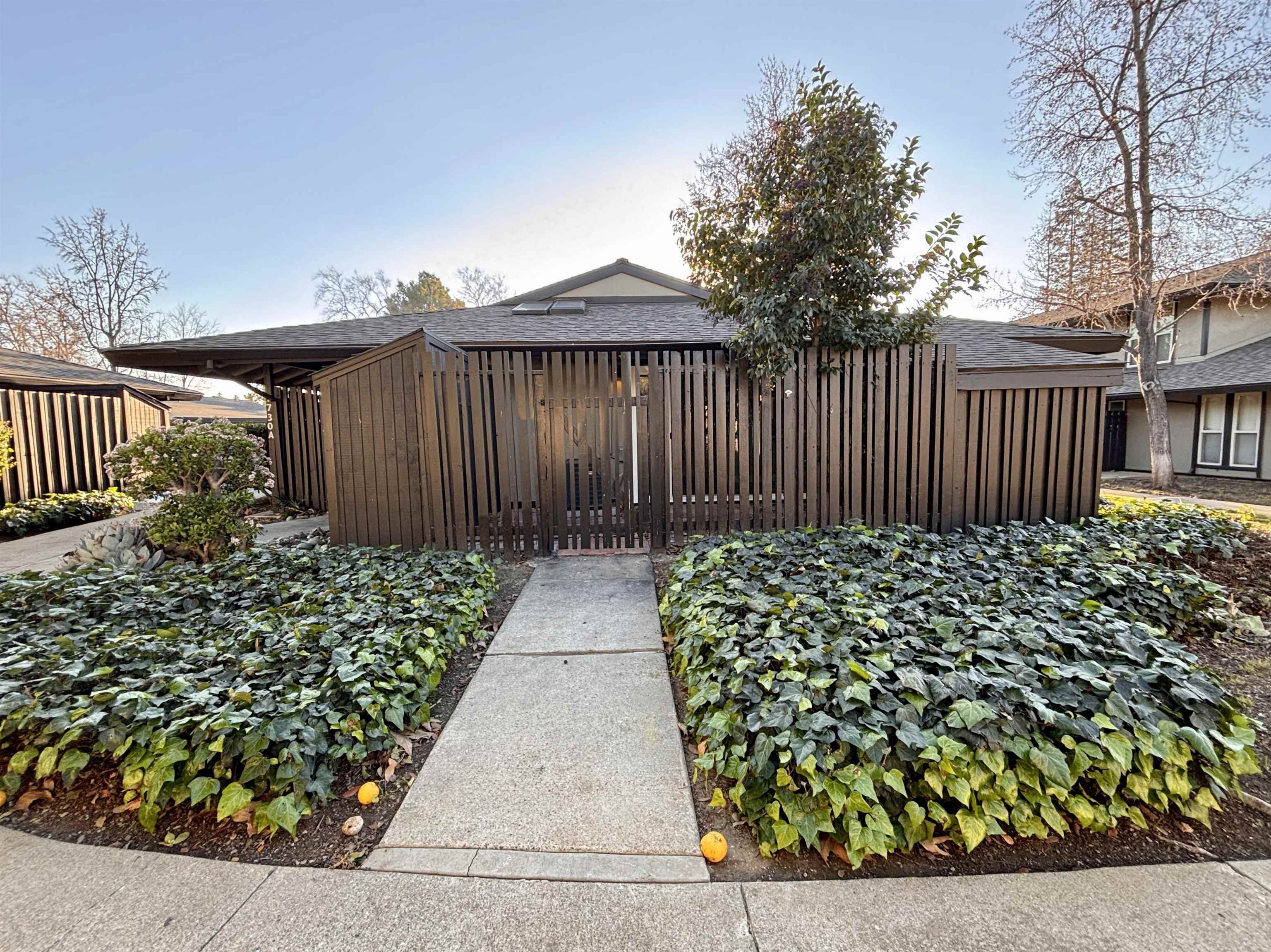 1730 Sapling Court, Unit A Concord, CA 94519 - Photo 3 of 32 a view of a pathway along a garden