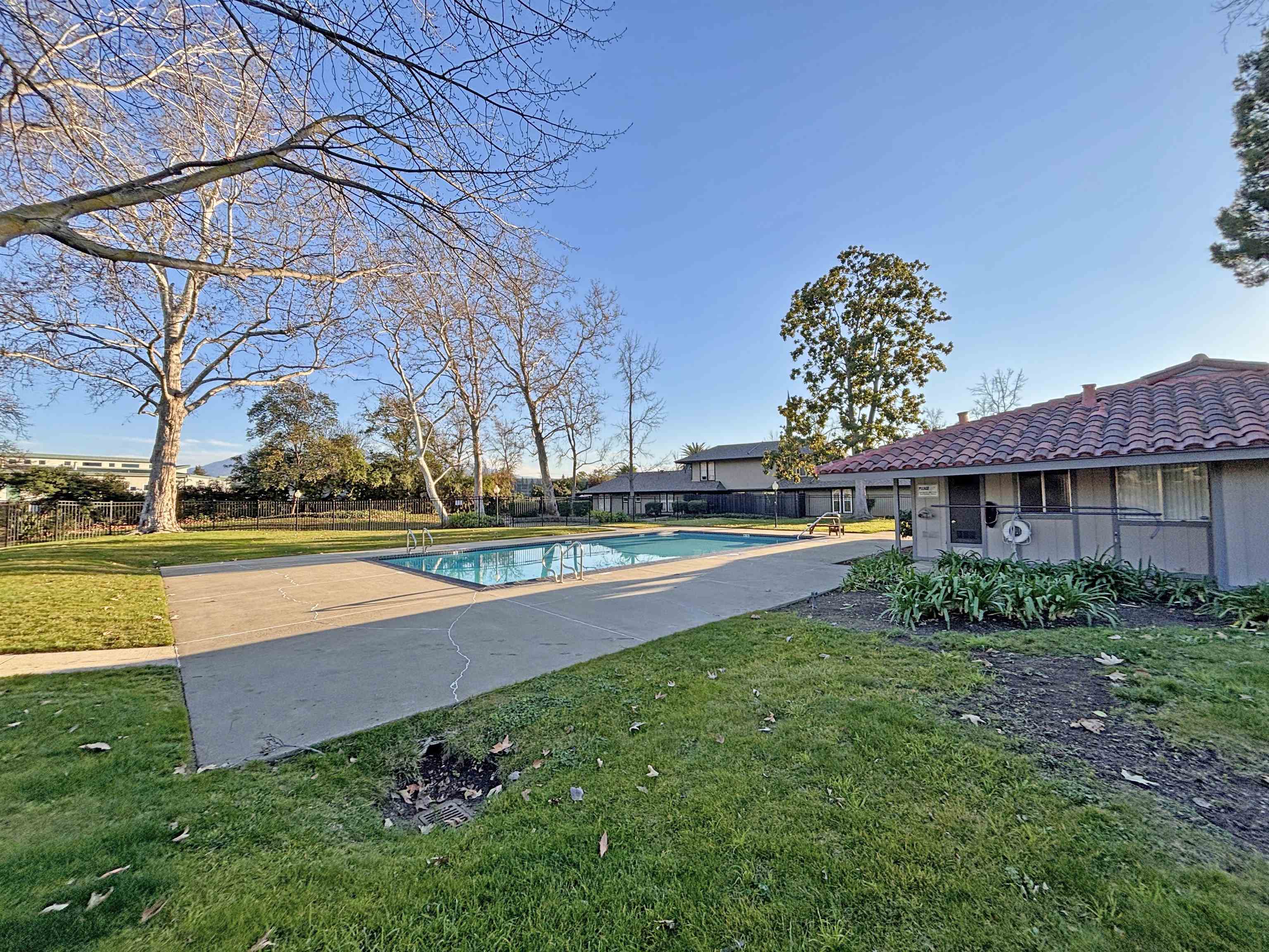 1730 Sapling Court, Unit A Concord, CA 94519 - Photo 31 of 32 a view of a house with a yard