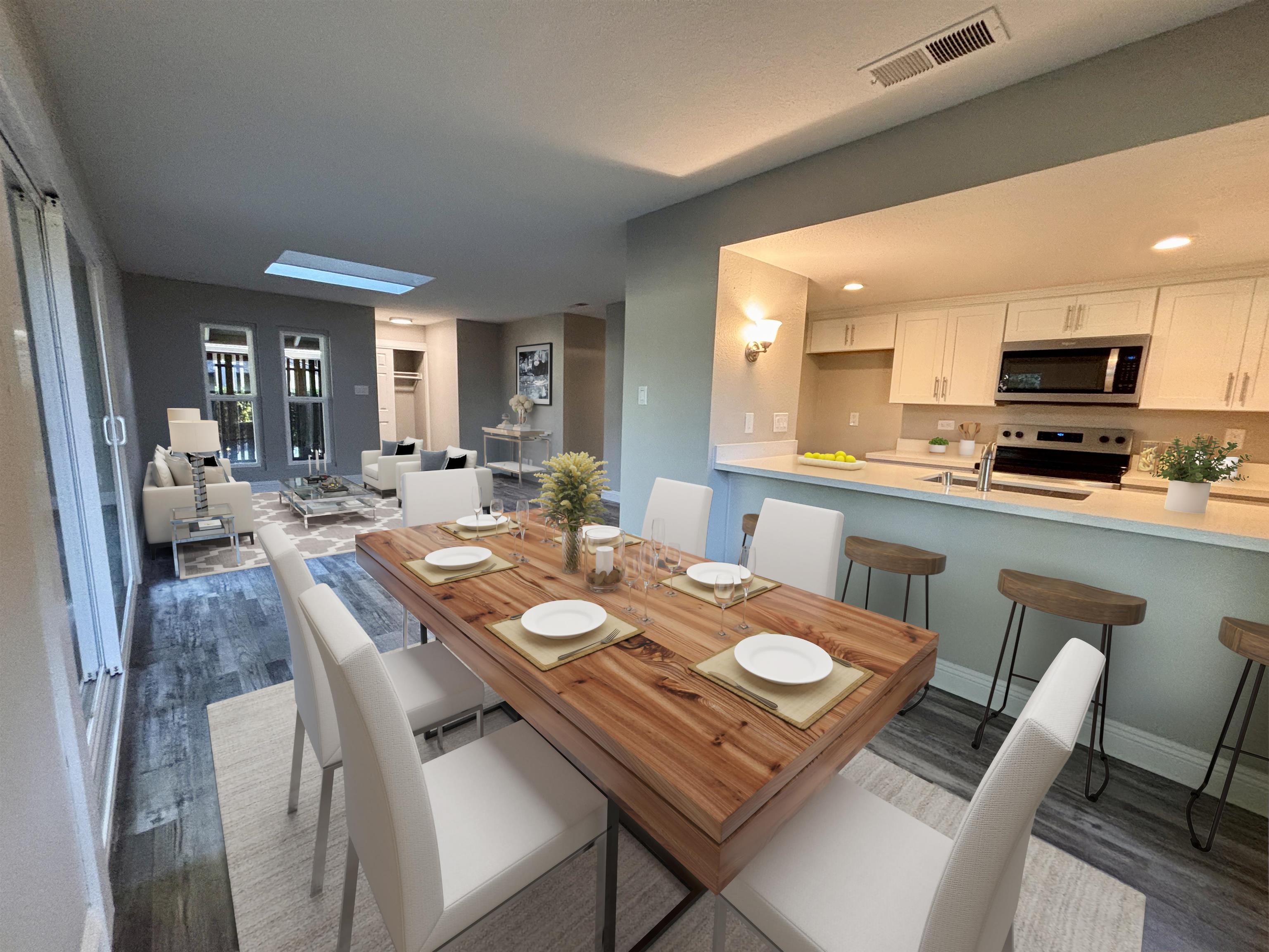 1730 Sapling Court, Unit A Concord, CA 94519 - Photo 8 of 32 a view of a dining room with furniture and a large window