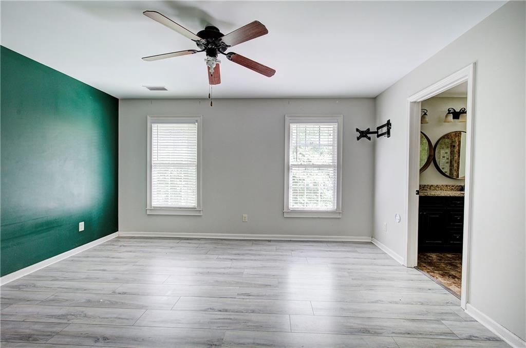 561 Holland Road Dallas, GA 30157 - Photo 24 of 48 wooden floor in an empty room with a window