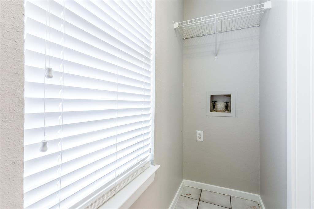 2311 Burleson Road, Unit B Austin, TX 78741 - Photo 13 of 24 Indoor laundry room with a door and sunny window