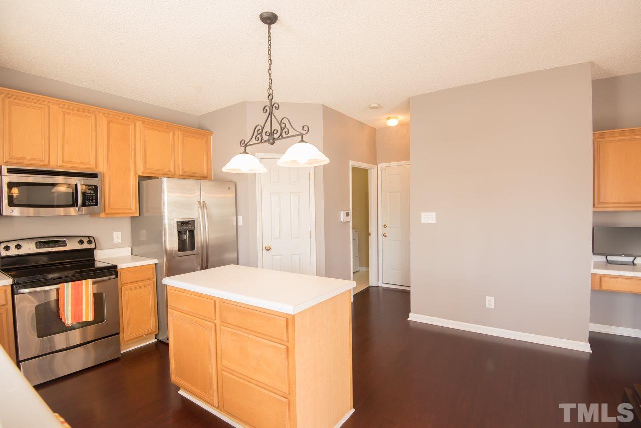 1303 Red Twig Road Apex, NC 27502 - Photo 10 of 27 The island adds some great workspace
